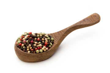 Pepper mix seed on spoon on white background.