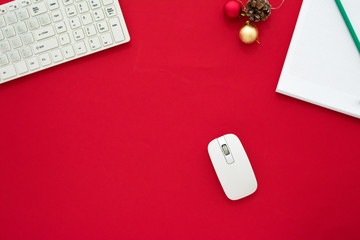 red Desk, notebook, keyboard and mouse, red background with copy space, for advertisement, top view