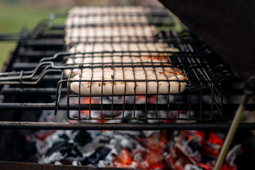 closeup of sausages on the barbecue in outdoor