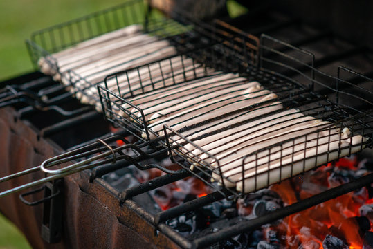 closeup of sausages on the barbecue in outdoor