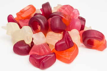 heap of gummy candy with different fruit flavors