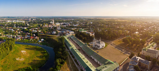 Beautiful panoramic view of Suzdal in summer at sunrise. Resurrection Church on the market square in Suzdal. Suzdal is a famous tourist attraction and part of the Golden Ring of Russia