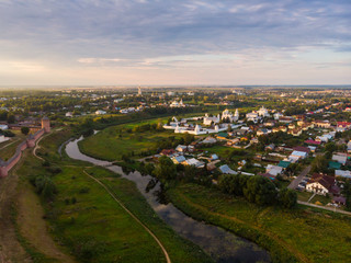 Scenic panoramic view of Suzdal, Russia. Intercession of the Theotokos convent at the small river. Suzdal is a famous tourist attraction and part of the Golden Ring of Russia.