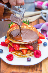 pancakes with chocolate and fresh berries
