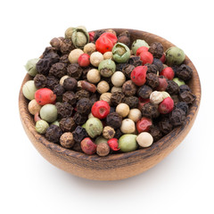 Pepper mix seed on spoon on white background.