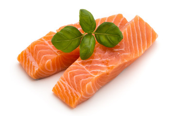 Fresh salmon fillet with basil on the white background.