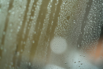 Closeup rain drops on car glass with hydrophobic coating