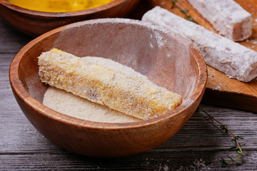 Raw fish sticks in a bowl