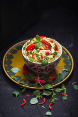 bowl guacamole tomato chilli pepper lime onion garlic dill and oregano