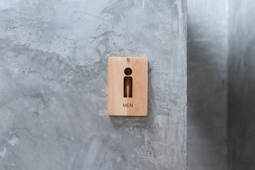 male toilet sign on wood