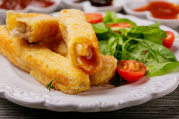 Fish sticks fried in breadcrumbs, close up
