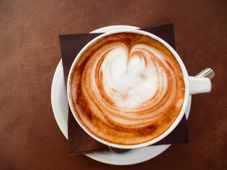 A cup of coffee with heart shape, latte art
