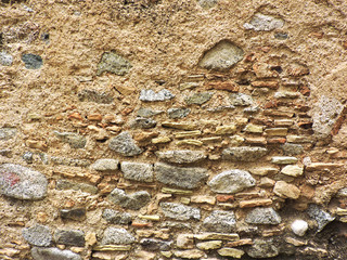 Old wall of stones, cement and bricks