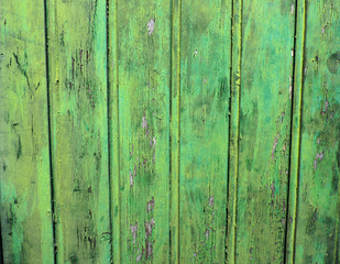 Fototapeta na wymiar Shabby craquelured old green wooden surface