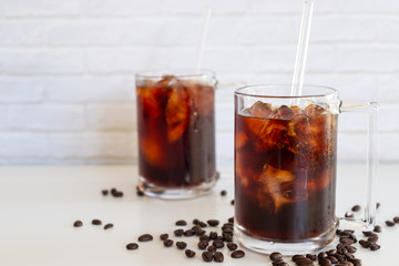 a glass of homemade cold cold brew coffee on white table
