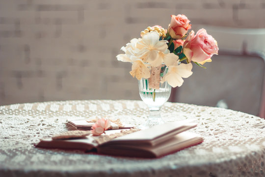Delicate composition with flowers in a vase