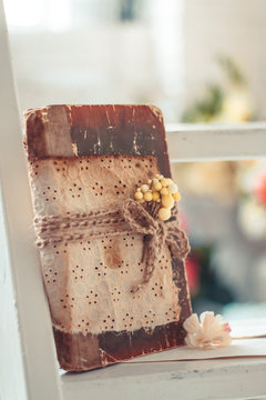 Delicate composition with old books decorated in rustic style