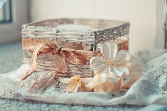 Delicate composition with an old basket and flowers decorated in