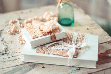 Delicate composition with old books decorated in rustic style