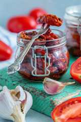 Sun-dried tomatoes with garlic, spices and olive oil.
