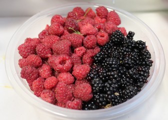 Raspberries and blaclberries in bowl