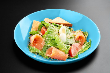 Salad tomatoes leaves salmon eggs basil Concept healthy meal black background menu restaurant