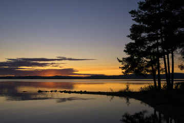 Fototapeta na wymiar Susnset at lake Orsa