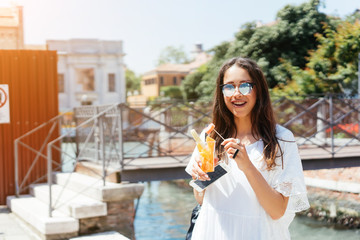 Beautiful young woman eating healthy food on travel vacation
