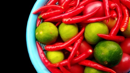 Fresh red chili and lemon on basket