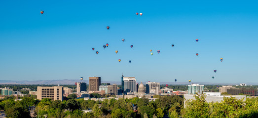 Many hot air balloons over the morning skyline of Boise Idaho