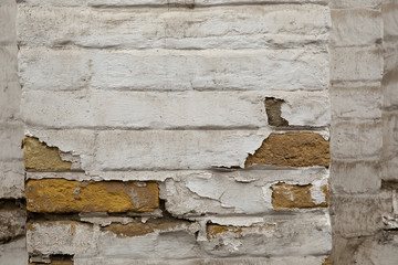 Grunge brick wall with white stucco background or texture.
