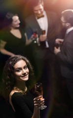 stylish young woman with glass of champagne