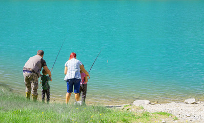 happy family fishing together 