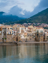 Fototapeta na wymiar Cefalù waterfront in a cloudy afternoon. Sicily, southern Italy.