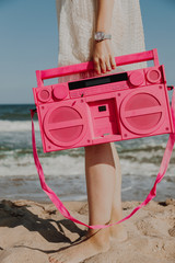 Retro portable stereo cassette recorder on the Beach