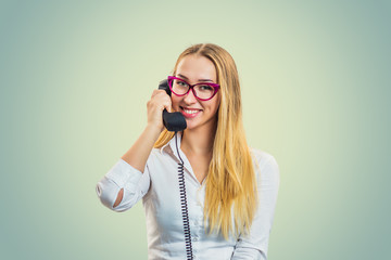 Smiling woman speaking on telephone