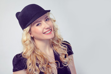 Adorable blond woman in stylish hat