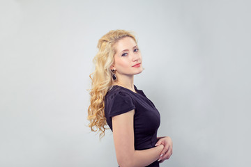Fototapeta premium Elegant young woman in black dress