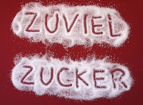 ZUVIEL ZUCKER,  Schrift in Zucker geschrieben