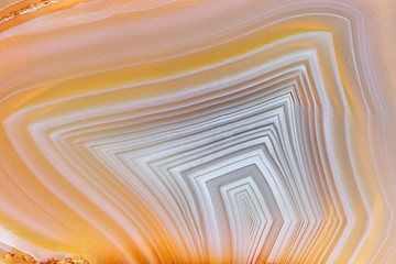 Amazing Banded Agate Crystal cross section as a background. Natural light translucent agate crystal surface, Gray abstract expressive structure slice mineral stone macro closeup - obrazy, fototapety, plakaty