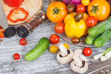 Still life from colored vegetables and mushrooms