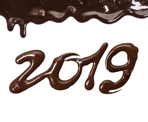 Date of the new year 2019 written by melted chocolate on a white background