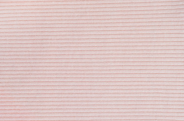 Texture of pink knitted silk sweater background