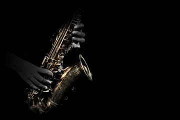 Saxophone player. Saxophonist playing jazz music instrument