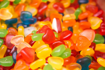 multi-colored heart-shaped jellies with different taste selective focus