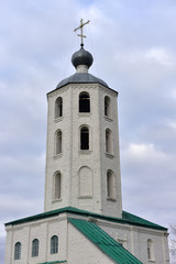 Fototapeta na wymiar Belfry with the Church of John the Merciful in Tsivilsk, Chuvash Republic.