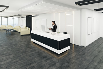 Businesswoman in modern office lobby