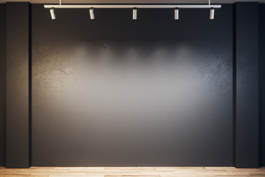 Black gallery with blank wall