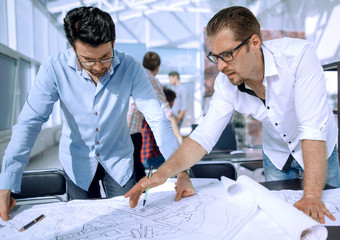 landscape designers discussing new sketches