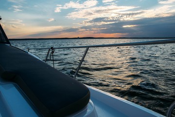 hull of a modern luxury yacht on the background of the sea at sunset. boat ride.